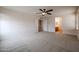Large bonus room offering flexible space with open doorway and ceiling fan at 4804 S 25Th Dr, Phoenix, AZ 85041
