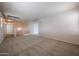 Spacious bonus room with neutral carpet and staircase access, ready for customization at 4804 S 25Th Dr, Phoenix, AZ 85041