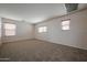 Expansive bonus room with three windows and neutral carpeting for versatile use at 4804 S 25Th Dr, Phoenix, AZ 85041
