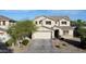 Charming two-story home showcasing a well-manicured yard and welcoming two-car garage at 4804 S 25Th Dr, Phoenix, AZ 85041