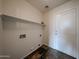 Clean laundry room featuring tile flooring and built in shelving at 4804 S 25Th Dr, Phoenix, AZ 85041