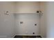 Functional laundry room with built-in shelf at 4804 S 25Th Dr, Phoenix, AZ 85041