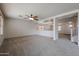 Spacious living room with neutral carpeting and modern ceiling fan provides a relaxing atmosphere at 4804 S 25Th Dr, Phoenix, AZ 85041