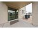 Back patio with sliding glass door to home with concrete slab and AC unit at 4804 S 25Th Dr, Phoenix, AZ 85041