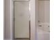 Clean bathroom featuring frosted glass shower door and tiled tub at 4804 S 25Th Dr, Phoenix, AZ 85041