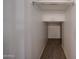 Walk-in closet offering organized storage with hanging rack and carpeted floor at 4804 S 25Th Dr, Phoenix, AZ 85041
