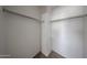 Walk-in closet with carpeted floors and racks for hanging clothes at 4804 S 25Th Dr, Phoenix, AZ 85041