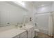 Well-lit bathroom featuring a vanity with ample counter space, a shower, and modern fixtures at 5096 S 245Th Dr, Buckeye, AZ 85326