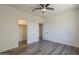 Bedroom featuring vinyl wood flooring, closet space, and natural light, ideal for relaxation at 5096 S 245Th Dr, Buckeye, AZ 85326