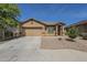 Charming single-story home features a two-car garage and low-maintenance landscaping at 5096 S 245Th Dr, Buckeye, AZ 85326