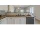 Kitchen sink and counter in an open-concept home layout showing view to living room at 5096 S 245Th Dr, Buckeye, AZ 85326