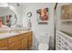 Bathroom with painted cow, a shower, a toilet, and vanity at 5154 N 83Rd St, Scottsdale, AZ 85250