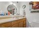 Bathroom vanity with a mirror and a painting of a cow at 5154 N 83Rd St, Scottsdale, AZ 85250