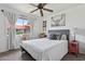 Bedroom featuring a full bed, a ceiling fan, and exterior window at 5154 N 83Rd St, Scottsdale, AZ 85250
