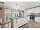 Kitchen with an island, granite counters, and stainless steel appliances at 5154 N 83Rd St, Scottsdale, AZ 85250