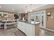 The kitchen features an island, white cabinets, stainless appliances, and access to a backyard patio at 5154 N 83Rd St, Scottsdale, AZ 85250