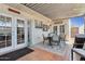 Inviting covered patio with outdoor seating area, decorative accents, and tiled flooring for relaxing and entertaining at 5154 N 83Rd St, Scottsdale, AZ 85250