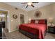 This main bedroom features a ceiling fan, tile flooring, and an ensuite bathroom at 5335 E Shea Blvd # 1094, Scottsdale, AZ 85254