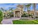 Elegant clubhouse exterior featuring palm trees and colorful flower beds at 5335 E Shea Blvd # 1094, Scottsdale, AZ 85254