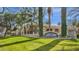 Well-manicured community entrance with lush landscaping and mature trees at 5335 E Shea Blvd # 1094, Scottsdale, AZ 85254