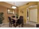 This dining room features a modern light fixture, an arched doorway, and tile flooring at 5335 E Shea Blvd # 1094, Scottsdale, AZ 85254