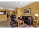This living room features leather furniture and an open floor plan to the dining area at 5335 E Shea Blvd # 1094, Scottsdale, AZ 85254