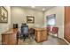 Well-lit home office featuring a wooden desk and comfortable chair at 5335 E Shea Blvd # 1094, Scottsdale, AZ 85254