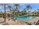 Stunning community pool with lounge chairs, lush landscaping, and shaded seating areas at 5335 E Shea Blvd # 1094, Scottsdale, AZ 85254