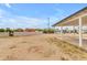 View of the backyard of the house, with a partial view of the exterior of the building at 546 N 96Th Pl, Mesa, AZ 85207