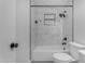 Clean bathroom featuring a tiled shower/tub combination, toilet and sink at 546 N 96Th Pl, Mesa, AZ 85207
