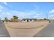 Exterior shot of a home featuring a neutral-toned exterior with an expansive gravel yard under a bright blue sky at 546 N 96Th Pl, Mesa, AZ 85207