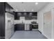 Updated kitchen featuring stainless steel appliances, black cabinets and sleek countertop at 546 N 96Th Pl, Mesa, AZ 85207