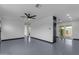 Spacious living area with a sleek ceiling fan, recessed lighting, and access to outdoor space at 546 N 96Th Pl, Mesa, AZ 85207