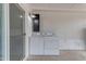 Covered patio featuring a laundry area and concrete floor at 546 N 96Th Pl, Mesa, AZ 85207
