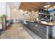 Modern bar area with a dark countertop, pendant lighting, and comfortable seating, ideal for socializing and relaxation at 6333 N Scottsdale Rd # 5, Scottsdale, AZ 85250