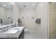 Charming bathroom with a marble countertop, decorative mirror, and elegant tile flooring at 6333 N Scottsdale Rd # 5, Scottsdale, AZ 85250
