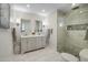 Bright bathroom with a double vanity, marble floors, and a glass-enclosed shower with stone accents at 6333 N Scottsdale Rd # 5, Scottsdale, AZ 85250