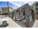 Lounge area with shaded cabanas, comfortable seating, and a ceiling fan, offering a relaxing outdoor experience at 6333 N Scottsdale Rd # 5, Scottsdale, AZ 85250