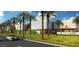 Commercial property with luxury stores, landscaping, and a high end car parked out front at 6333 N Scottsdale Rd # 5, Scottsdale, AZ 85250