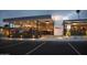 The Fat Ox restaurant featuring modern architecture, glass enclosed dining, and outdoor lighting at 6333 N Scottsdale Rd # 5, Scottsdale, AZ 85250