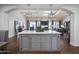 Spacious kitchen with large island, modern light fixtures and open living room concept at 6333 N Scottsdale Rd # 5, Scottsdale, AZ 85250
