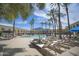 Expansive pool area with abundant lounge chairs and palm trees, creating a tranquil and inviting oasis for relaxation and recreation at 6333 N Scottsdale Rd # 5, Scottsdale, AZ 85250