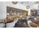 Elegant dining space with modern lighting fixtures, tables set with blue linens, and comfortable seating at 6333 N Scottsdale Rd # 5, Scottsdale, AZ 85250