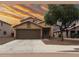 Charming single-Gathering home featuring a two-car garage, desert landscaping, and a warm, inviting curb appeal at 6538 W Nez Perce St, Phoenix, AZ 85043