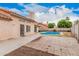 This backyard features a kidney-shaped pool and an entertainment patio area at 845 N Oak Ct, Chandler, AZ 85226