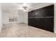 Basement featuring tiled floor, window, and a wall with built-in storage at 845 N Oak Ct, Chandler, AZ 85226