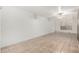 Bright basement area with tile flooring, a window, ceiling fan, and painted brick walls at 845 N Oak Ct, Chandler, AZ 85226