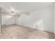 Spacious basement with tile flooring, ceiling fan, and white-painted brick walls at 845 N Oak Ct, Chandler, AZ 85226