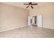 Spacious bedroom with neutral walls, tile flooring, and ample natural light at 845 N Oak Ct, Chandler, AZ 85226