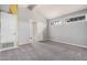 This bedroom features neutral carpeting, two windows for natural lighting, and a closet at 845 N Oak Ct, Chandler, AZ 85226